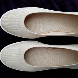 Slip on casual knit shoes in a sand khaki color
